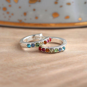 Pom - silver plated rainbow crystal inset huggie hoop earrings